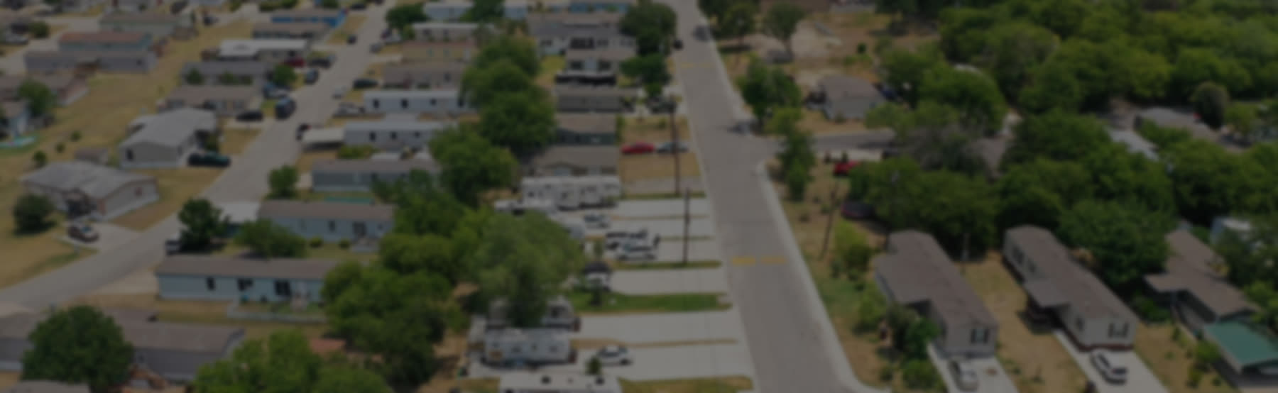 Manufactured home with covered porch at Blessing Community